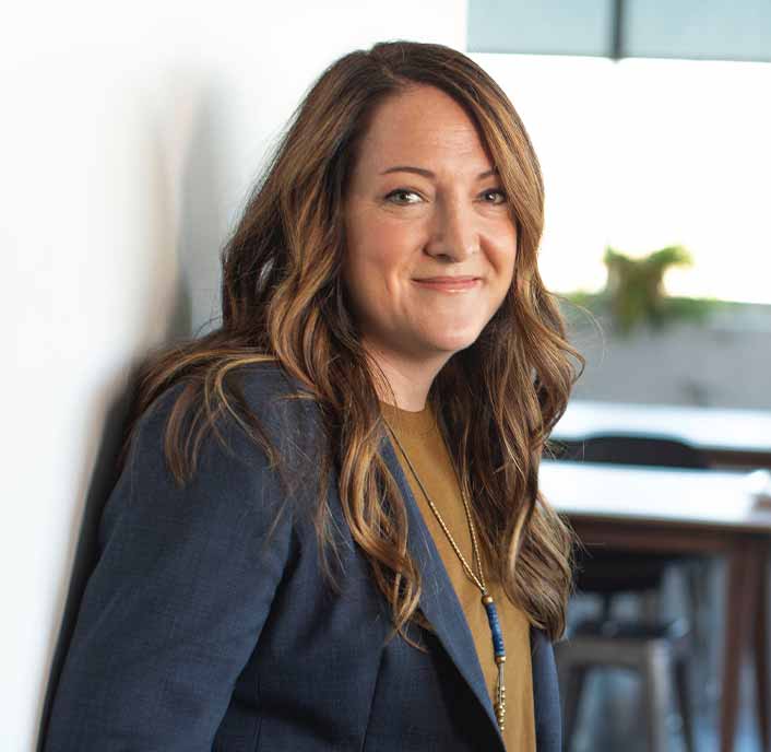 Woman Standing Against Wall Smiling Woman Standing Against Wall Smiling